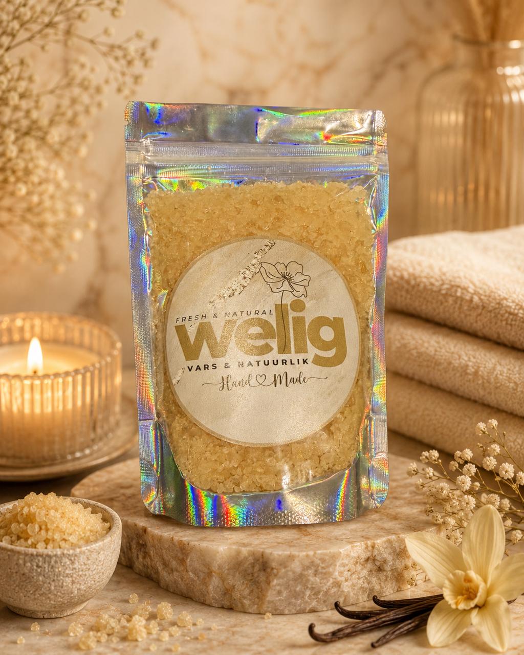 Pouch of welig product with a candle and flowers on a wooden surface
