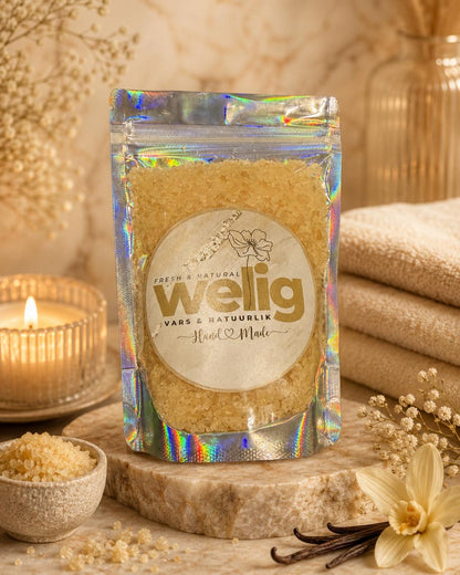 Pouch of welig product with a candle and flowers on a wooden surface